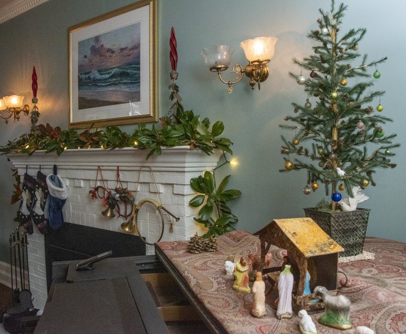 Beebe Frazer’s mantel is tastefully decorated with seasonal greens.